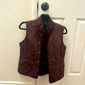 Eddie Bauer burgundy vest. Keeps you warm and it’s stylish. Gently worn!